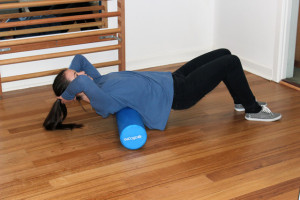 Foam rolling the thoracic spine muscles (mid back muscles)